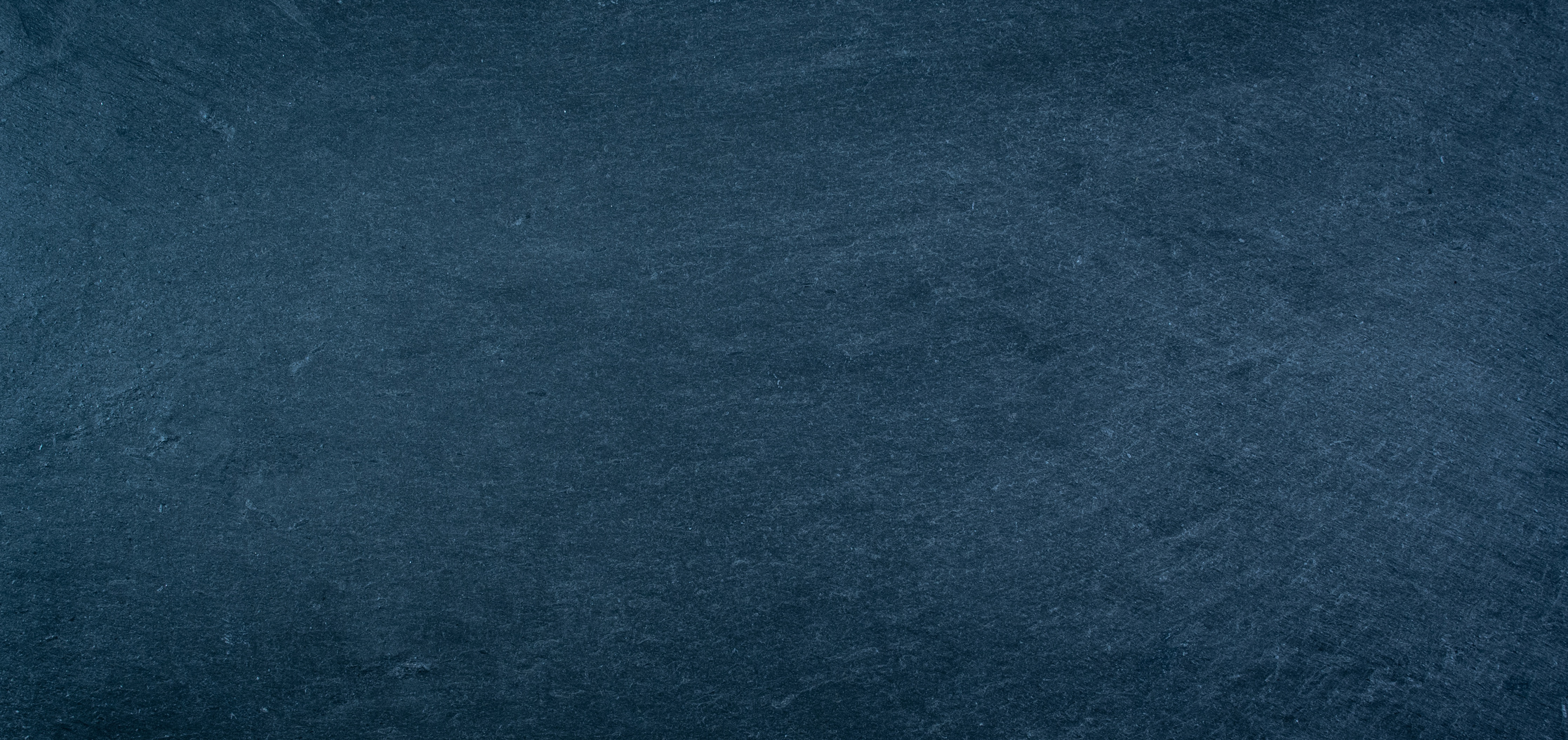 Dark blue slate texture background.